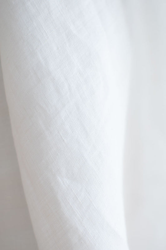 Close-up of white linen fabric texture
