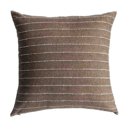 Brown pillow with white stripes on a white background