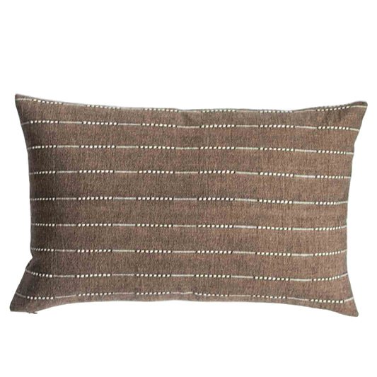 Brown pillow with white stripes on a white background