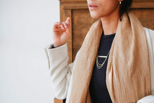 woman wearing fair trade jewelry and accessories