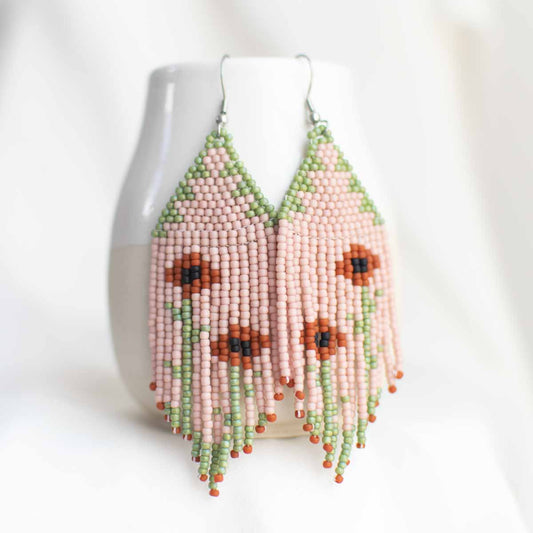 Beaded earring with poppy flower design.
