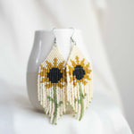Beaded earring with sunflower design.