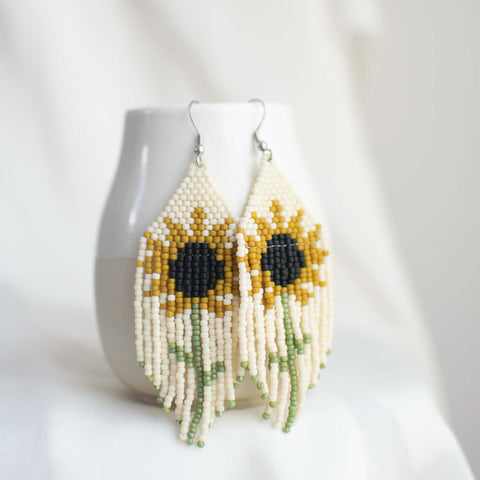 Beaded earring with sunflower design.