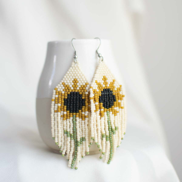 Beaded earring with sunflower design.