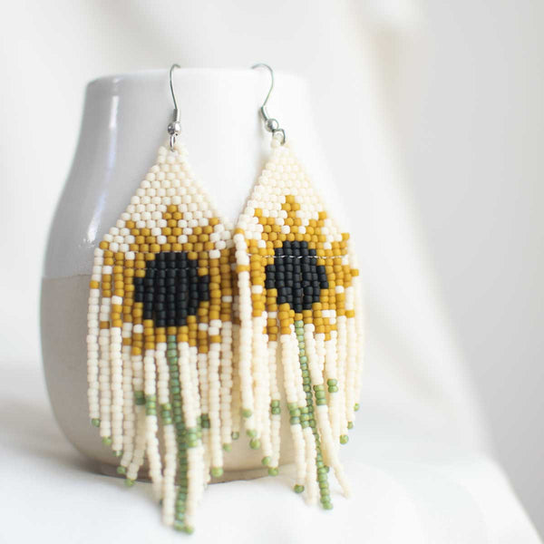Woven seed bead earring with floral sunflower design.
