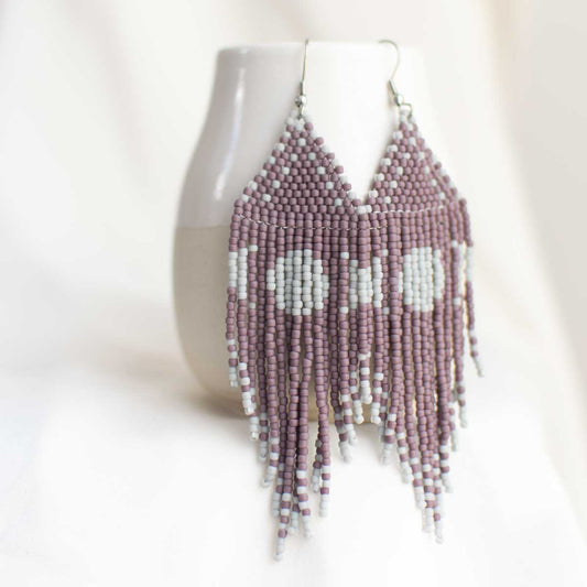 Purple and grey beaded earrings with moon design.