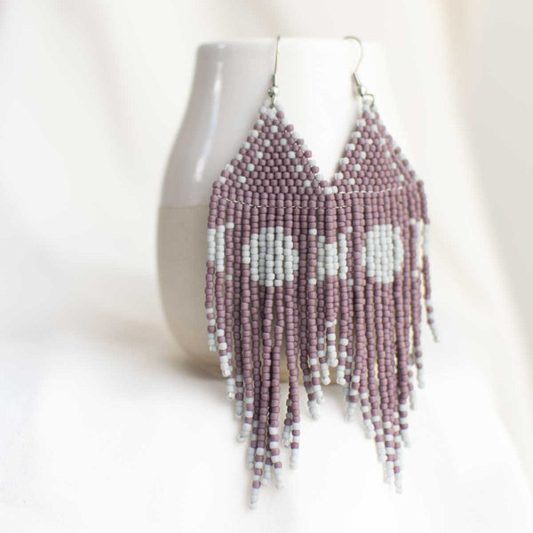 Purple and grey beaded earrings with moon design.