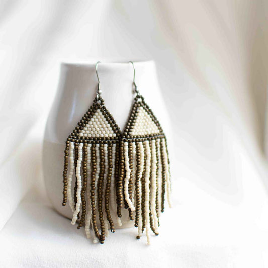 Beaded earrings with green and beige stripes and beige triangles.