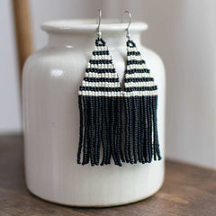 Beaded earrings with woven striped seed beads.