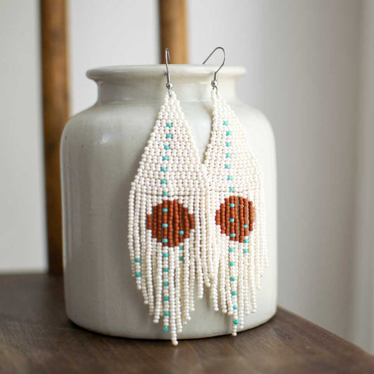 Beaded fringe earrings with simple circle design.