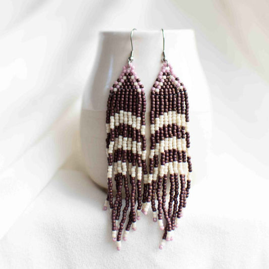 Seed bead earrings in purple and white.