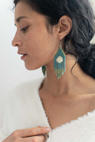 women wearing beaded fringe earrings