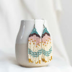 Beaded earrings with fringe.