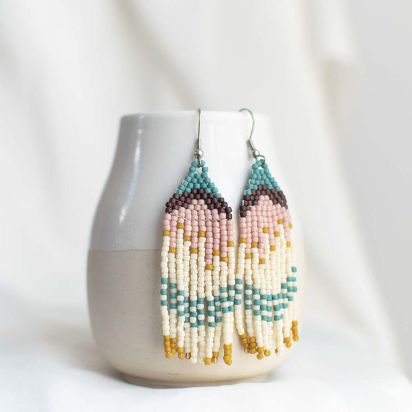 Beaded earrings with fringe.