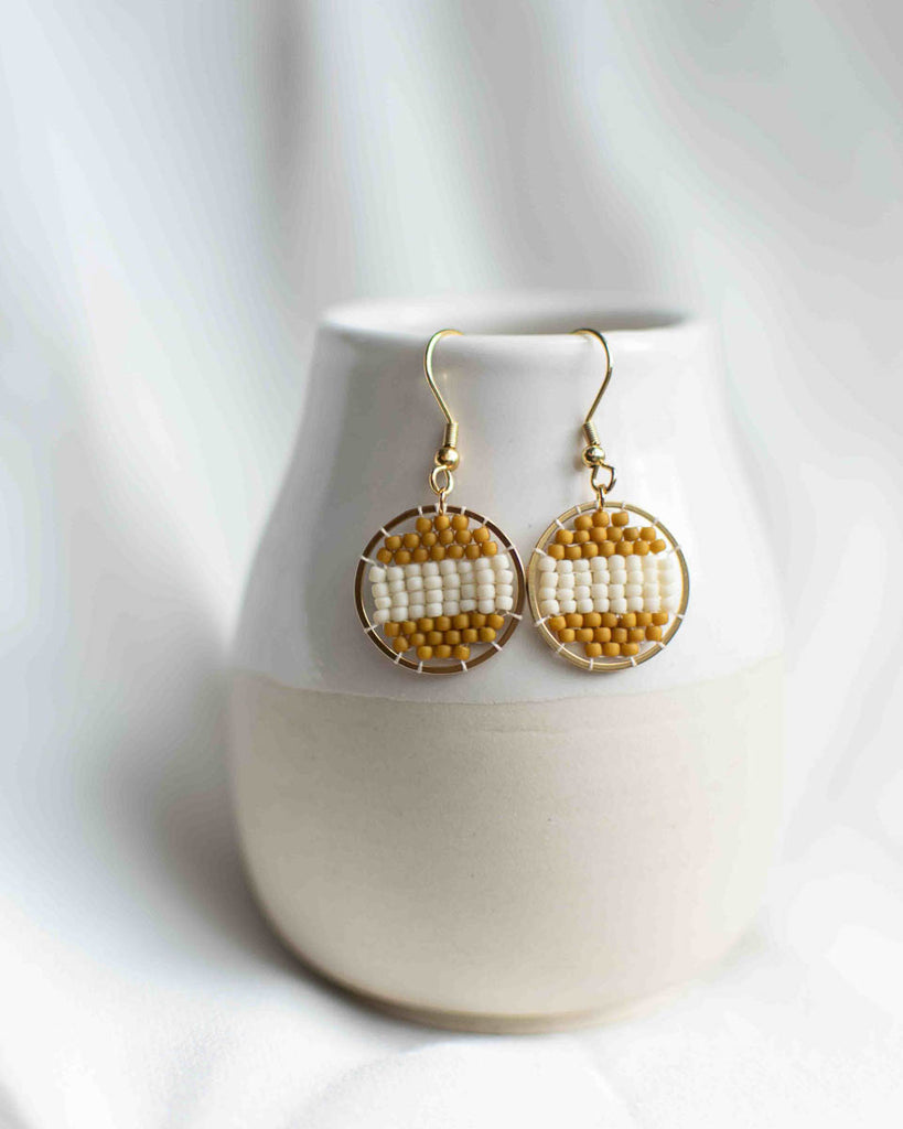 striped mustard and white round pendant beaded earrings