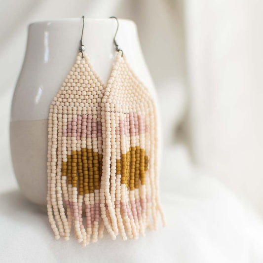 Minimal beaded fringe earrings with yellow circle and pink arches.