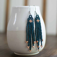 Beaded earrings with fringe in green and rose gold.