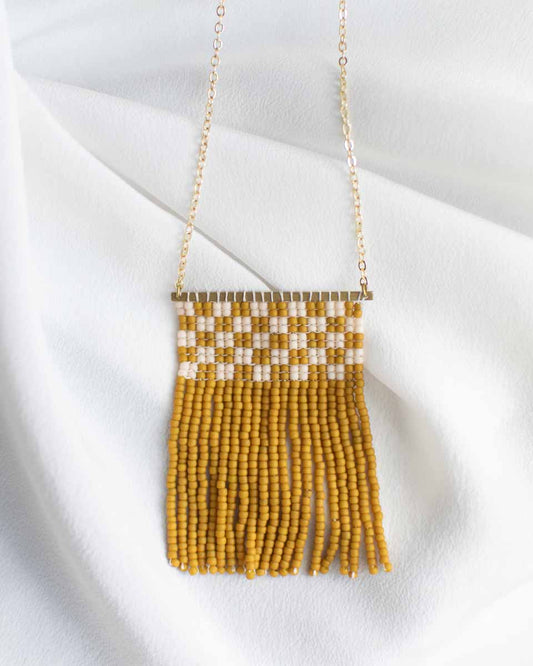 Simple beaded fringe necklace with mustard yellow and off white seed beads.