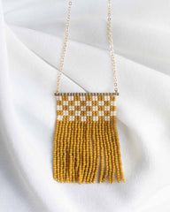 Simple beaded fringe necklace with mustard yellow and off white seed beads.