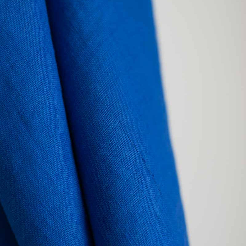 Close-up of blue fabric with a white background