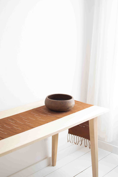 simple table runner on table with bowl