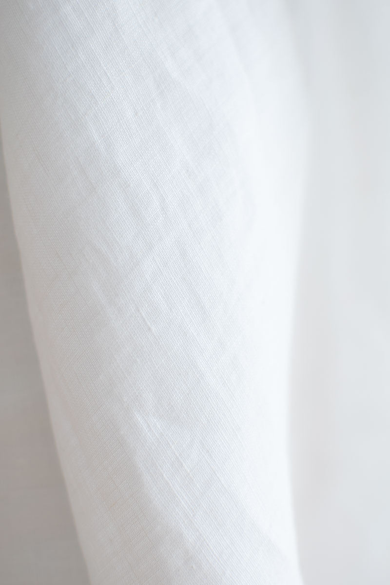 Close-up of white linen fabric texture