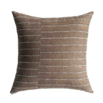 Brown pillow with white line pattern on a white background