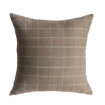 Plaid patterned pillow on a white background