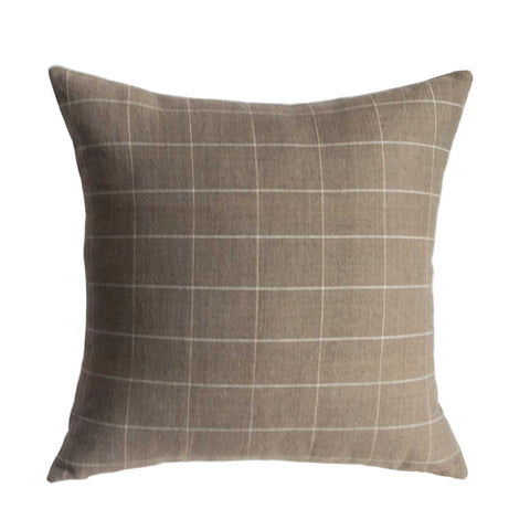Plaid patterned pillow on a white background