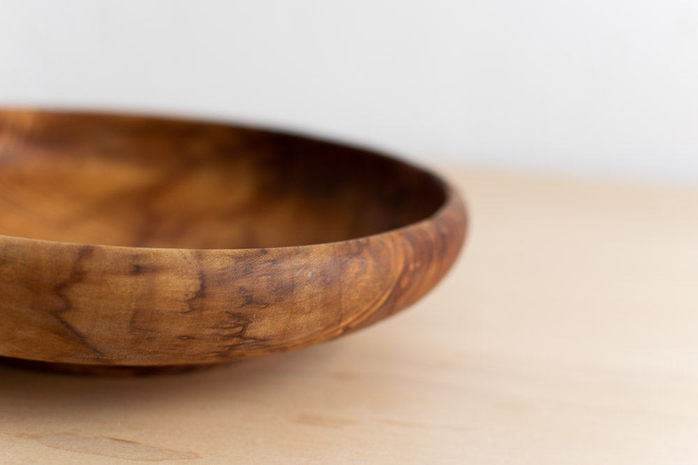 rim of small wooden handmade bowl
