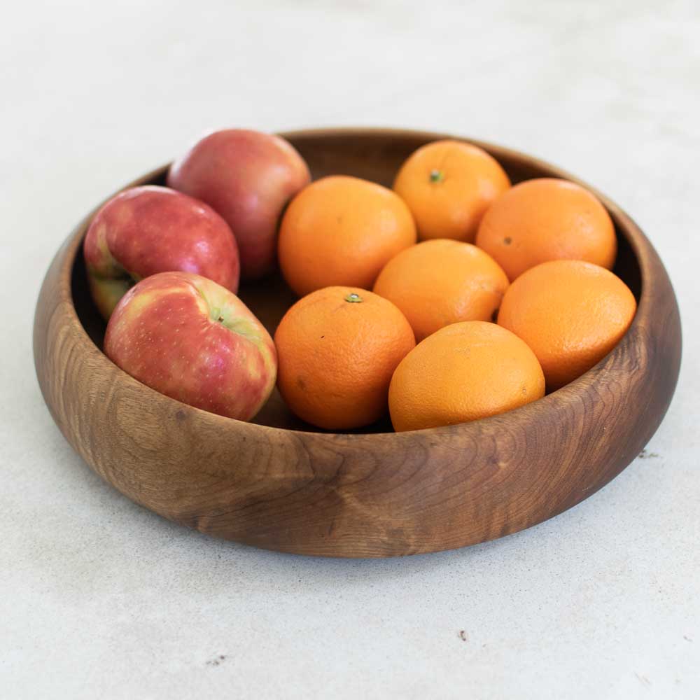 Wooden bowl filled with apples and oranges