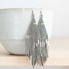 Beaded fringe earrings with grey seed beads.
