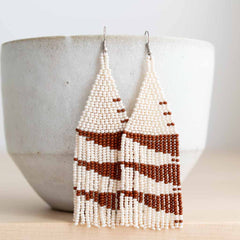 Beaded fringe earrings with modern triangular designs.