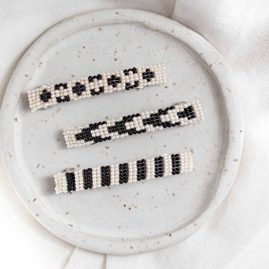 Set of three beaded barrettes in black and off white.