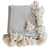 Striped cotton woven coverlet with pom poms