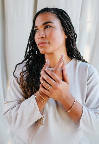woman wearing simple fair trade jewelry