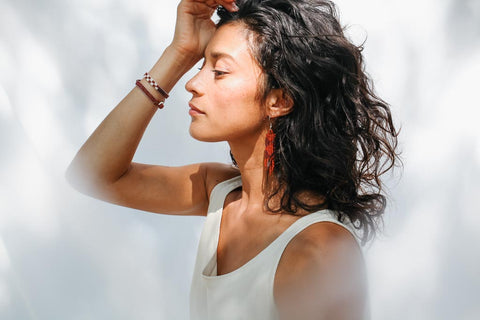 woman wearing beaded fair trade jewelry
