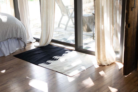 black and off white triangle rug