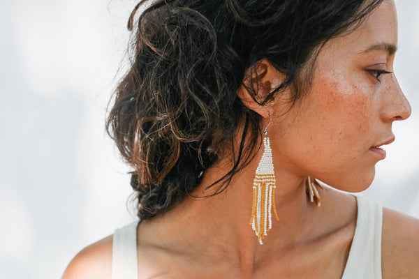 fair trade beaded earrings on woman