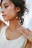woman wearing fair trade earrings
