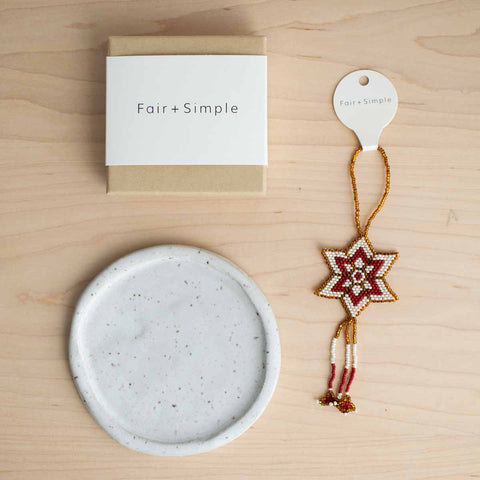 simple holiday gift box with jewelry, ornament, and ceramic dish