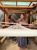 Mayan women warping a pedal loom together